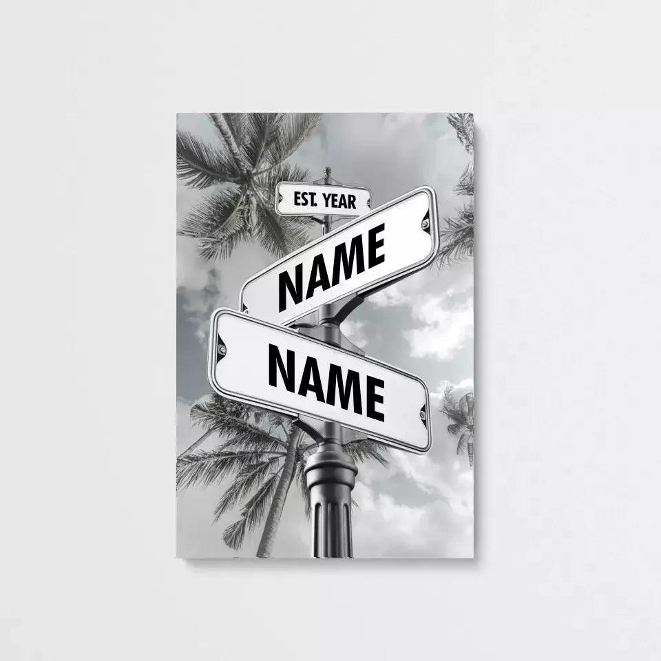 Unframed black and white street sign canvas with two custom names above vintage palm trees