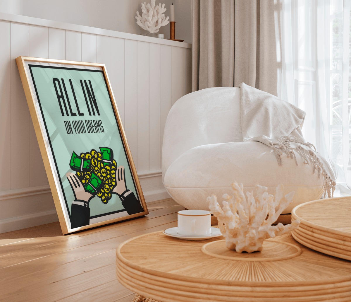 Gold framed mint poster of hands catching dollar bills and coins in a bright coastal room