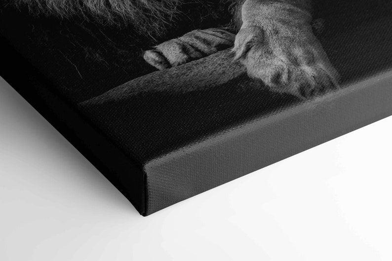 Close up detail of the canvas edge showing the lion paws printed on textured gallery wrapped fabric