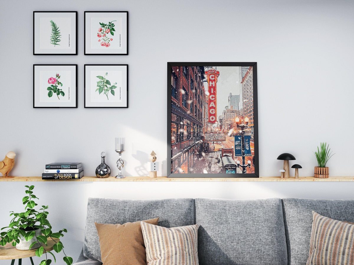 Chicago Theatre snow poster on a living room shelf next to botanical prints above a grey sofa