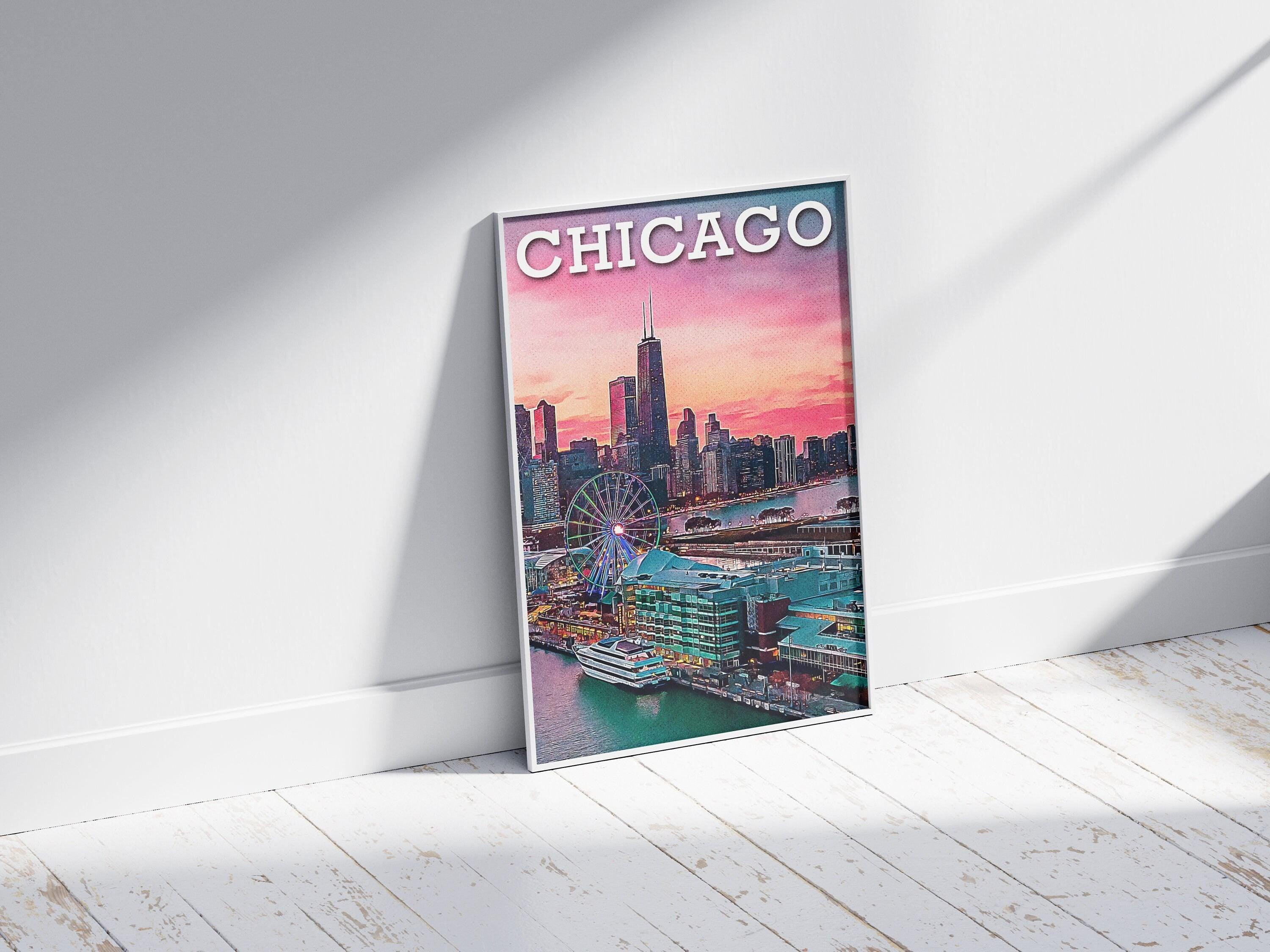 White framed Chicago poster leaning on a wall over white wood floor in soft daylight