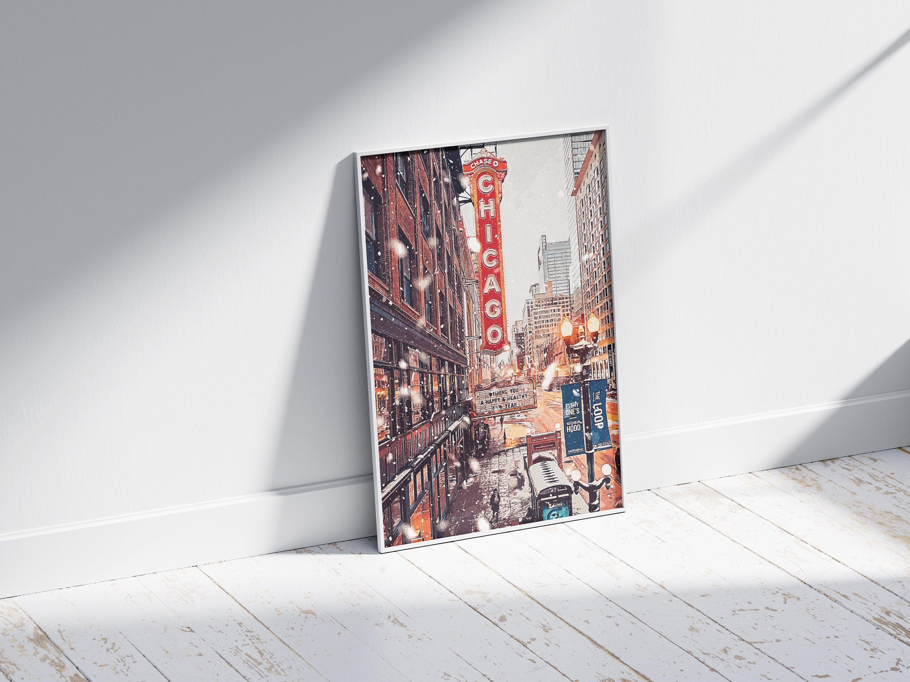 White framed Chicago street print leaning against a wall on whitewashed wooden floorboards