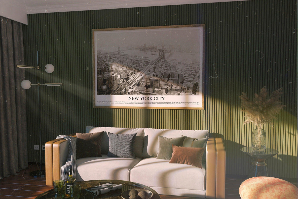 New York City historical bridge print in wood frame on a dark green slatted wall above a cream sofa
