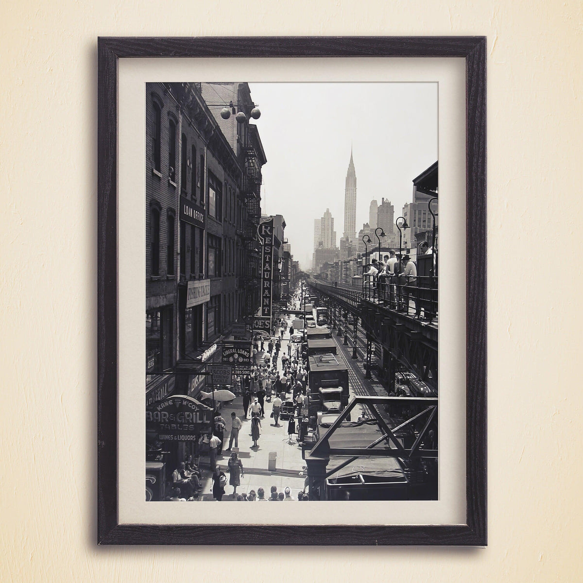 1930s Manhattan street crowd, elevated train tracks and Chrysler Building spire in a dark wood frame