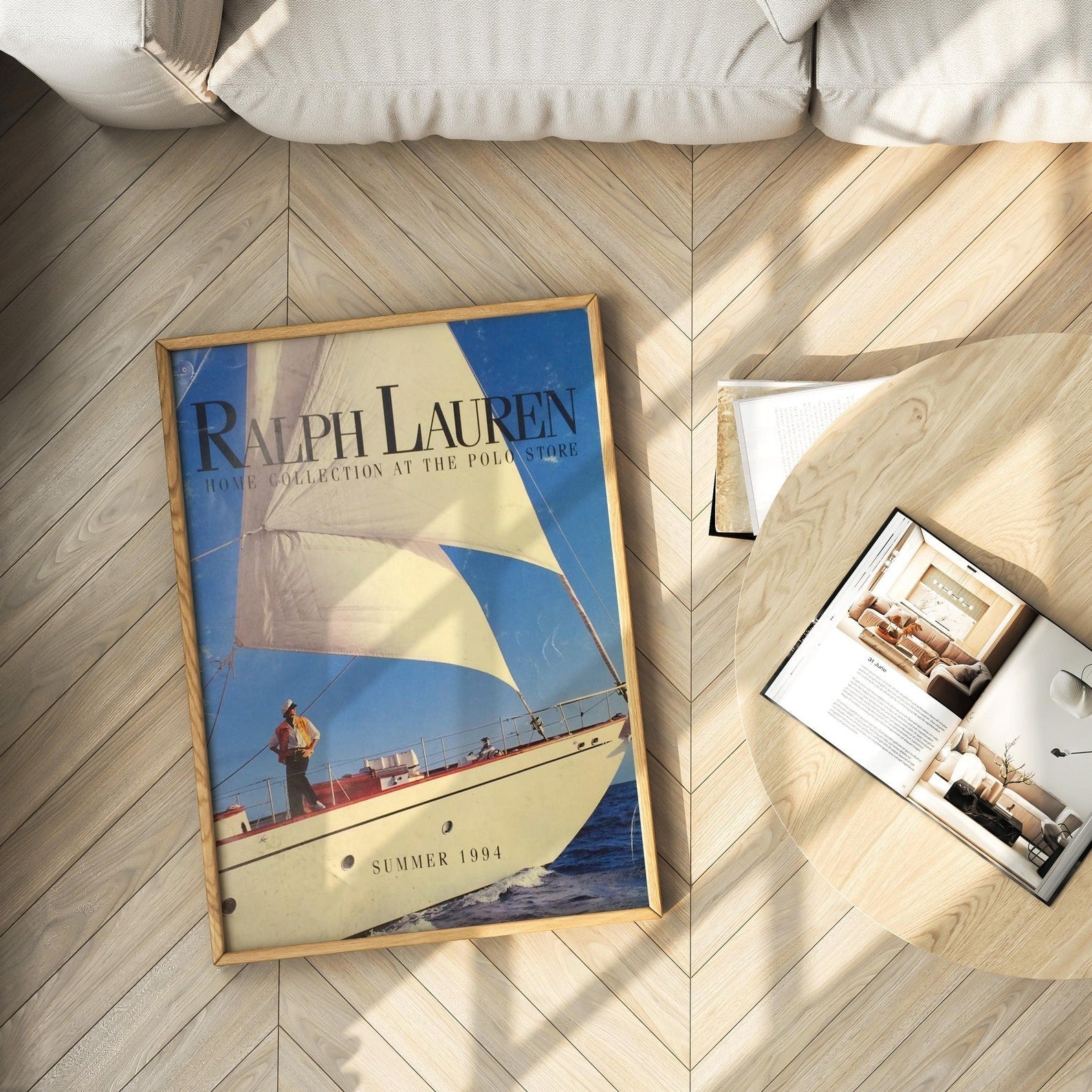 Old Money aesthetic flat lay with vintage sailboat art print on herringbone wood floor and fashion magazine.